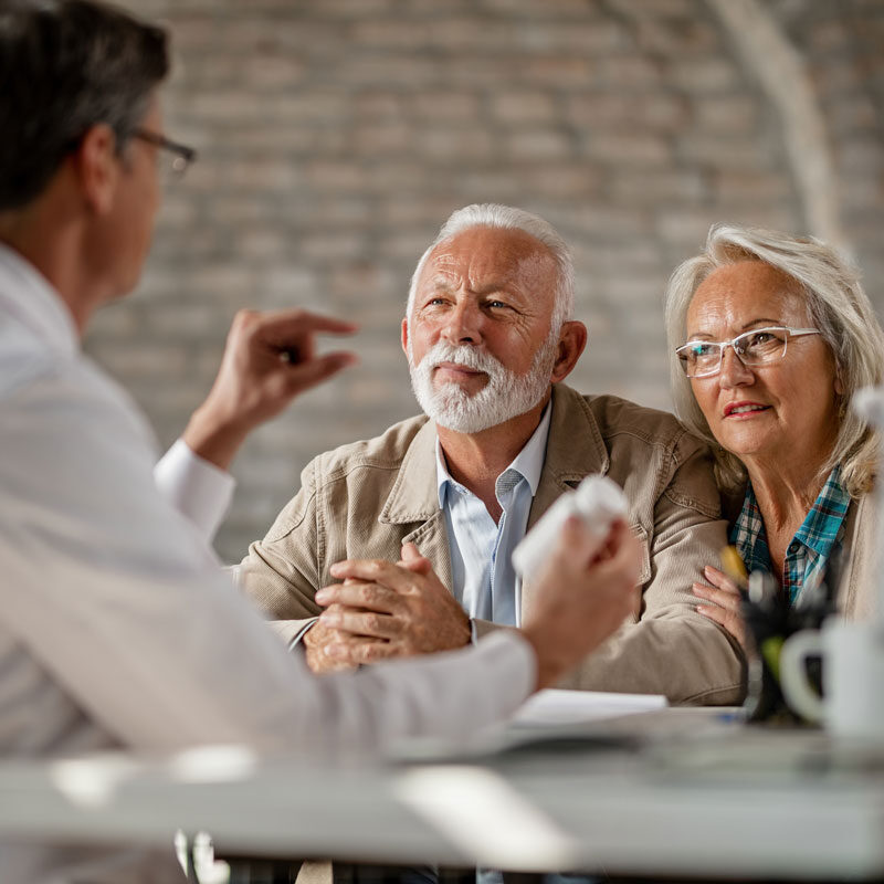 two old couples on a desk with a doctor.