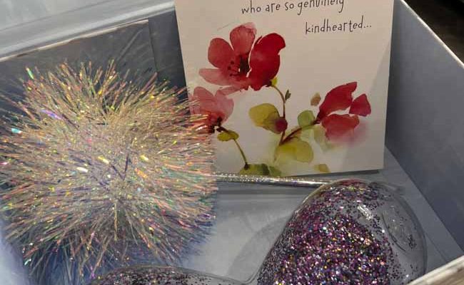 A gift box with a greeting card